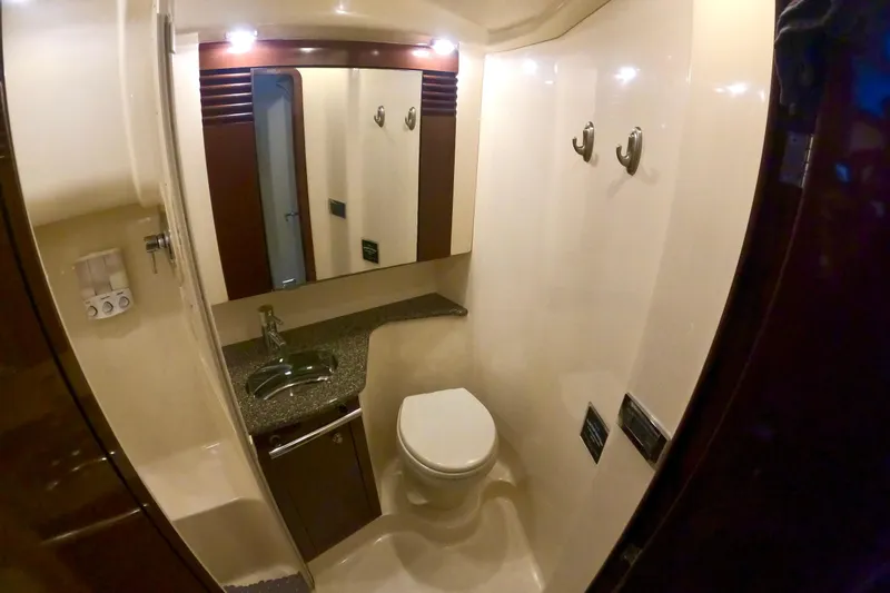  Yacht Photos Pics Luxurious bathroom in 2009 Sea Ray 44 Sedan Bridge yacht, featuring modern fixtures and elegant design.