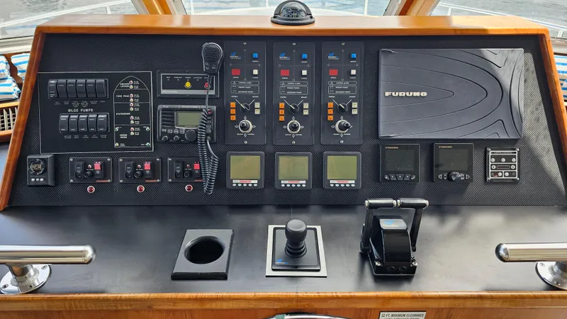 Island Soul Yacht Photos Pics Control panel of a 2009 Custom Flybridge Motoryacht with navigation and communication equipment.