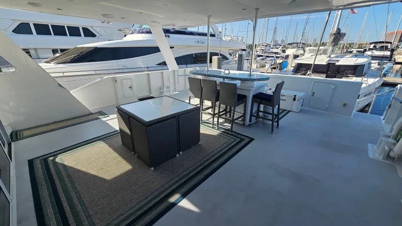 Island Soul Yacht Photos Pics Spacious deck of 2009 Custom Flybridge Motoryacht with seating and marina view.