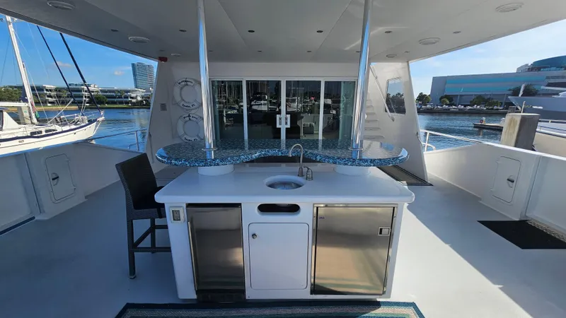Island Soul Yacht Photos Pics Luxurious 2009 Custom Flybridge Motoryacht with outdoor kitchen and marina view.