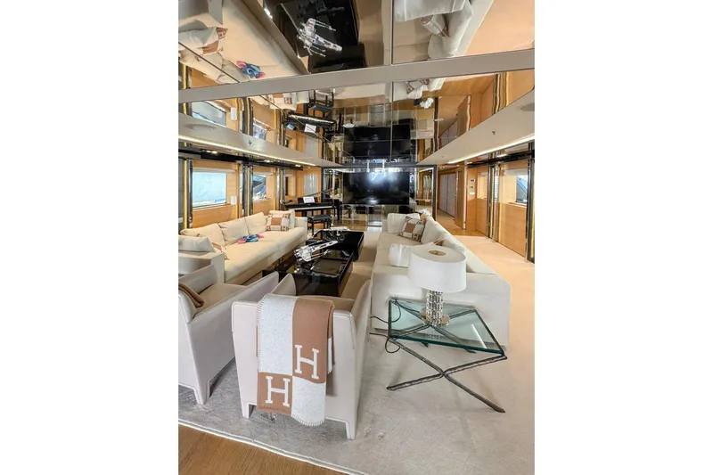  Yacht Photos Pics Luxurious yacht interior with modern furnishings, glass table, and plush seating, Factoria Naval de Marin 40, 2013.