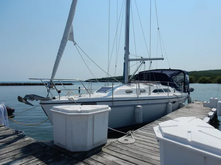 Milky Way Yacht Photos Pics 2004 Catalina 350 sailboat docked at a marina on a sunny day.