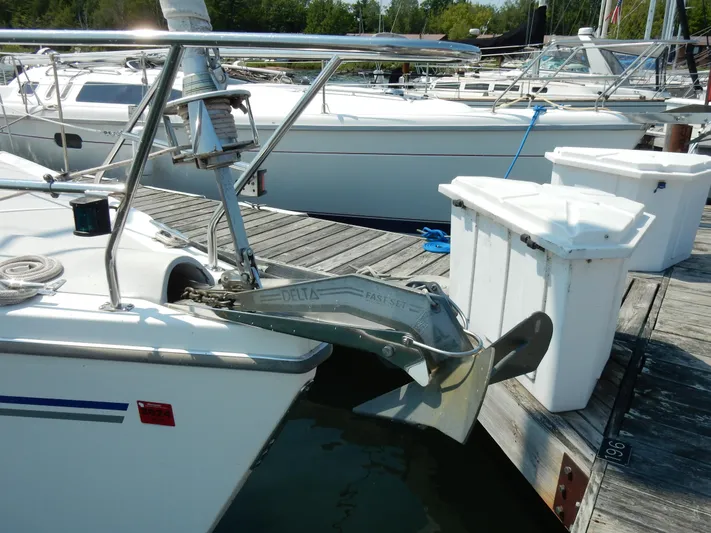 Milky Way Yacht Photos Pics Catalina 350 sailboat from 2004 docked, featuring a prominent anchor and deck equipment.