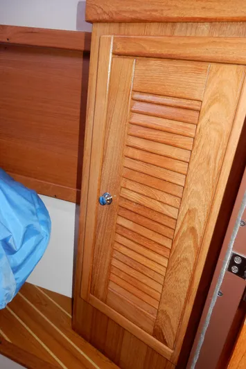 Milky Way Yacht Photos Pics Wooden cabinet door inside a 2004 Catalina 350 sailboat interior.