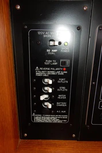 Milky Way Yacht Photos Pics Electrical panel of a 2004 Catalina 350 boat, featuring various switches and indicators.