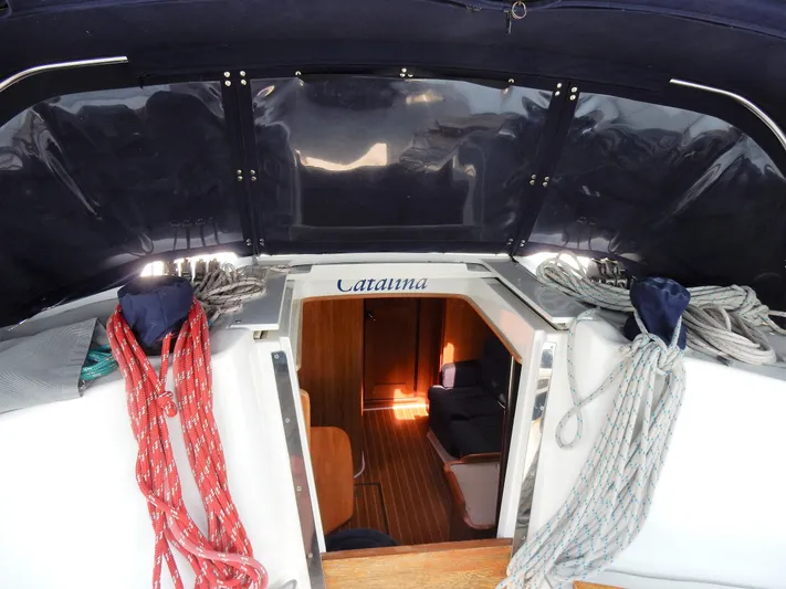 Milky Way Yacht Photos Pics 2004 Catalina 350 sailboat interior view with ropes and cabin entrance.