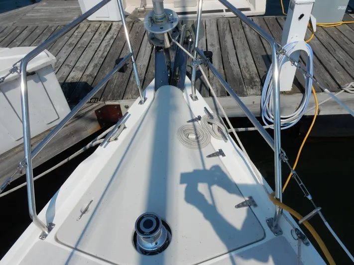 Milky Way Yacht Photos Pics Bow of a 2004 Catalina 350 sailboat docked, featuring deck hardware and railing.