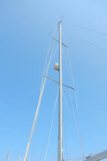 Milky Way Yacht Photos Pics Mast of 2004 Catalina 350 sailboat against clear blue sky.