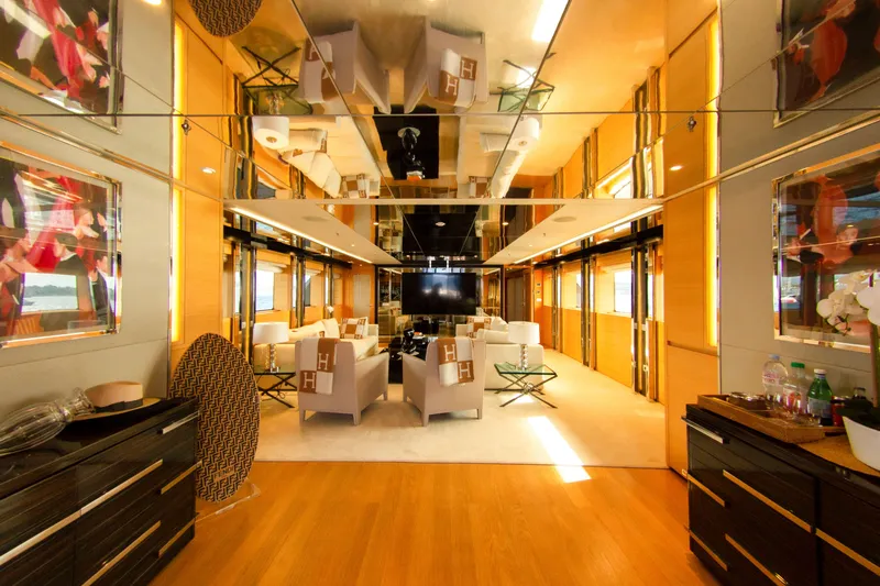 Yacht Photos Pics Luxurious yacht interior with elegant seating, mirrored ceiling, and modern decor, Factoria Naval de Marin 2013.
