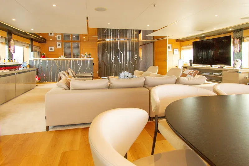  Yacht Photos Pics Luxurious yacht interior with modern decor, spacious seating, and large TV, Factoria Naval de Marin 40, 2013.
