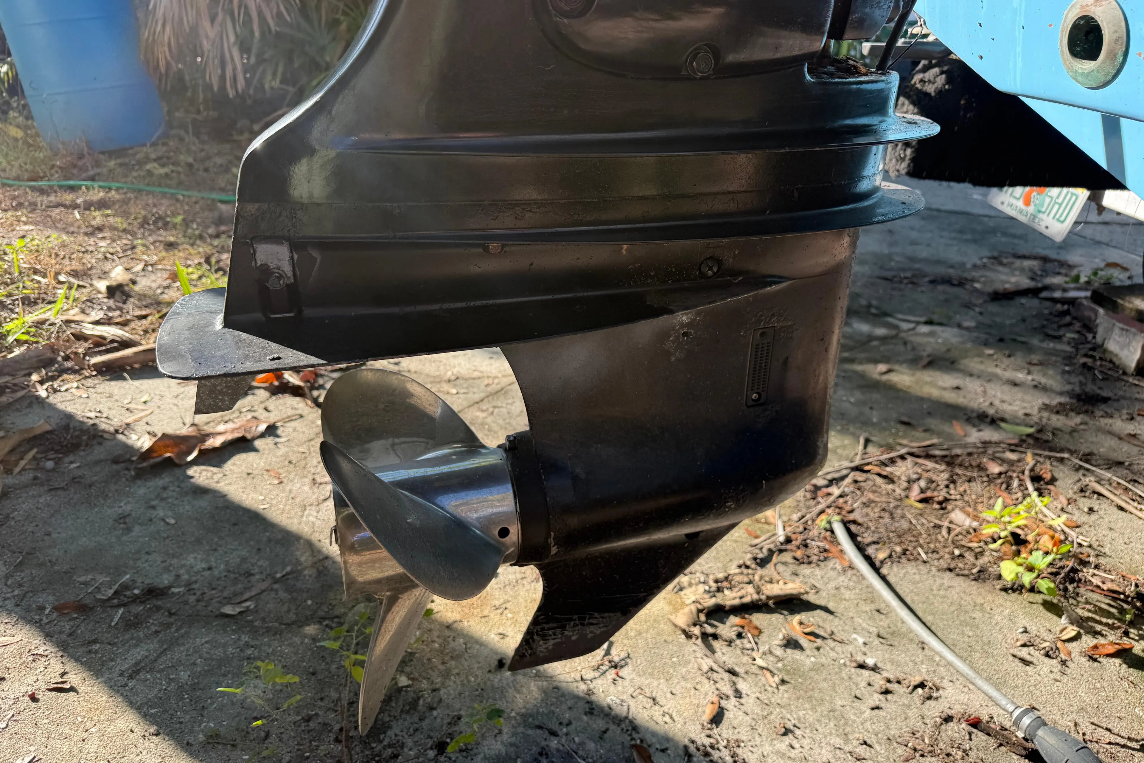 Close-up of a 2002 Fishmaster 212 Travis Edition boat propeller in sunlight.
