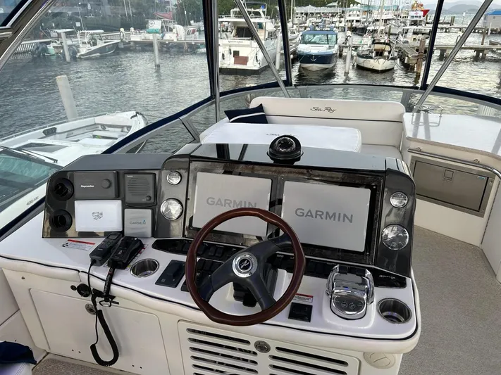 Someday Came Yacht Photos Pics 2008 Sea Ray 47 Sedan Bridge helm with Garmin navigation, docked at marina.