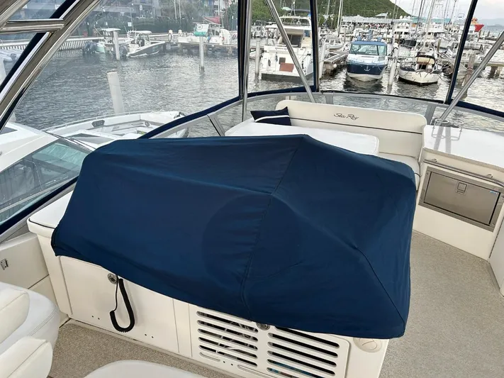 Someday Came Yacht Photos Pics 2008 Sea Ray 47 Sedan Bridge yacht interior with covered equipment, marina view.