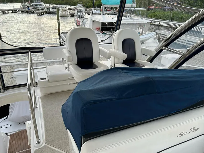 Someday Came Yacht Photos Pics 2008 Sea Ray 47 Sedan Bridge yacht interior with helm seats and marina view.