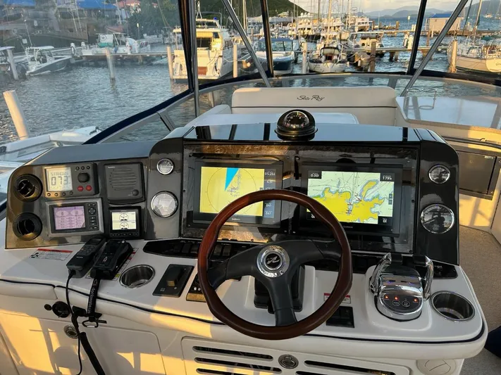 Someday Came Yacht Photos Pics 2008 Sea Ray 47 Sedan Bridge helm with navigation screens and controls at marina.