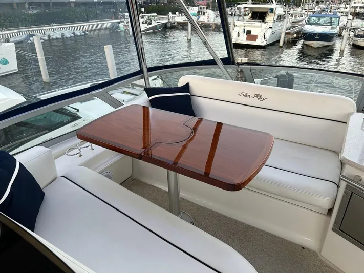Someday Came Yacht Photos Pics Luxurious 2008 Sea Ray 47 Sedan Bridge yacht interior with elegant seating and polished wood table.