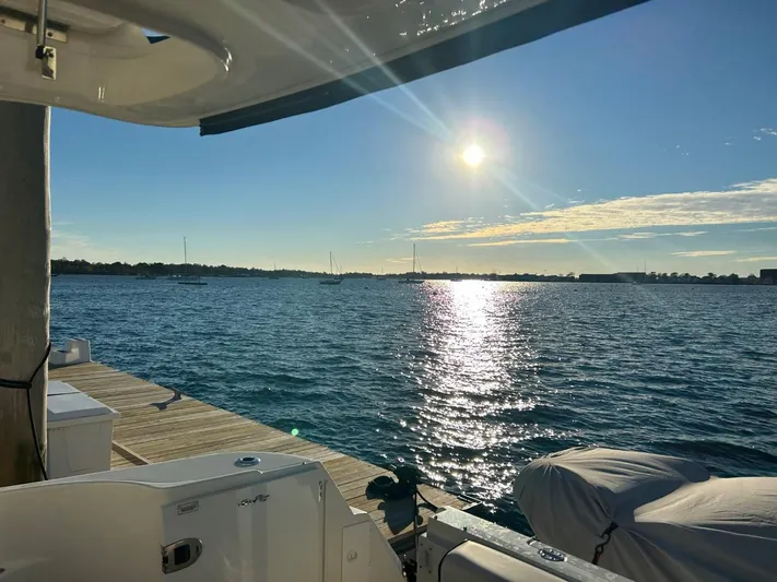Someday Came Yacht Photos Pics 2008 Sea Ray 47 Sedan Bridge yacht docked at sunset with scenic water view.