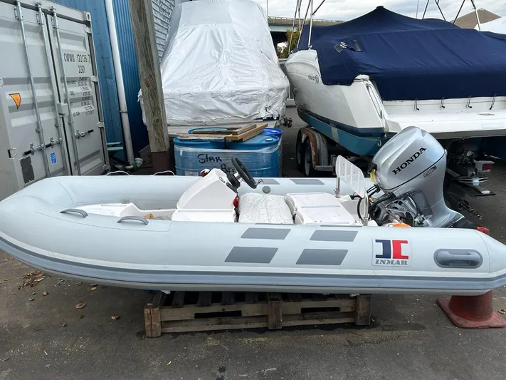 Someday Came Yacht Photos Pics Inflatable boat with Honda motor beside covered Sea Ray 47 Sedan Bridge, 2008 model.