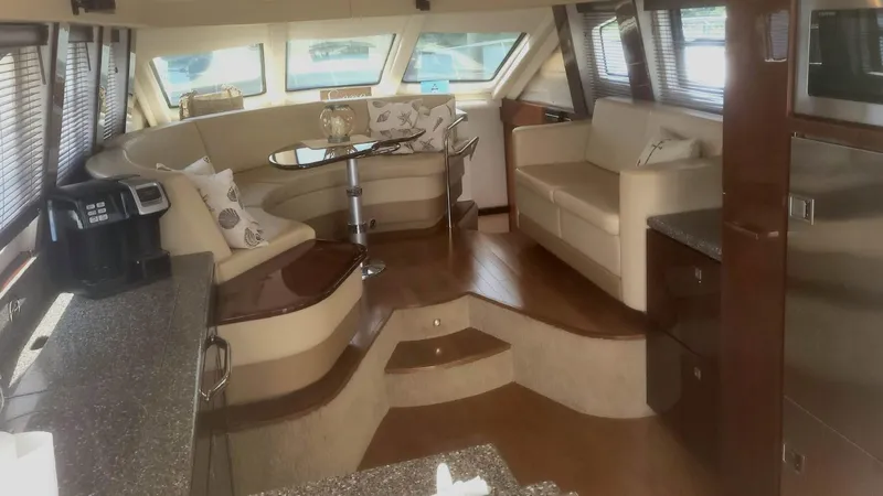 Someday Came Yacht Photos Pics Luxurious interior of 2008 Sea Ray 47 Sedan Bridge yacht with elegant seating and modern amenities.