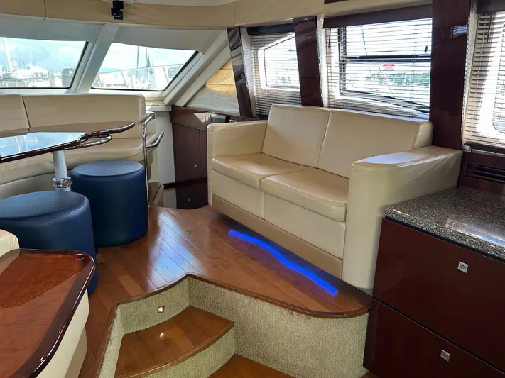 Someday Came Yacht Photos Pics Luxurious interior of 2008 Sea Ray 47 Sedan Bridge yacht with leather seating and wood accents.