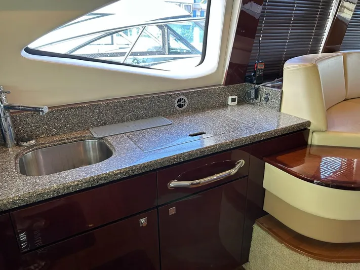 Someday Came Yacht Photos Pics Interior of 2008 Sea Ray 47 Sedan Bridge yacht with granite countertop and sink.