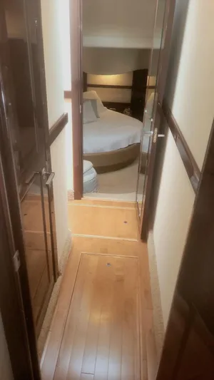 Someday Came Yacht Photos Pics Narrow hallway leading to a cozy bedroom in a 2008 Sea Ray 47 Sedan Bridge yacht.