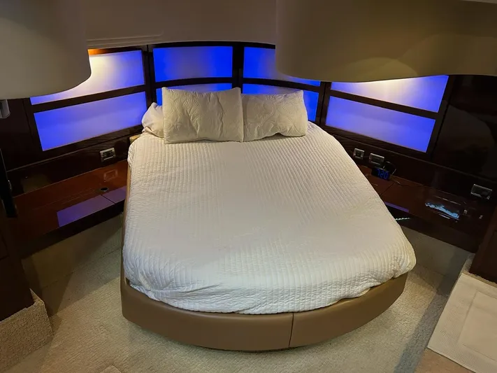 Someday Came Yacht Photos Pics Luxurious bedroom interior of 2008 Sea Ray 47 Sedan Bridge yacht with ambient lighting.