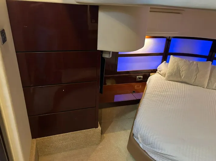Someday Came Yacht Photos Pics Luxurious bedroom interior of 2008 Sea Ray 47 Sedan Bridge yacht with modern lighting.