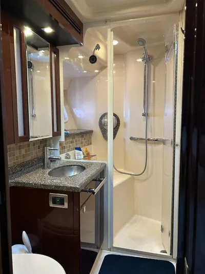 Someday Came Yacht Photos Pics Luxurious bathroom in 2008 Sea Ray 47 Sedan Bridge yacht with modern fixtures.