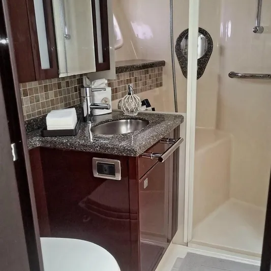 Someday Came Yacht Photos Pics Luxurious bathroom in 2008 Sea Ray 47 Sedan Bridge yacht with modern fixtures.