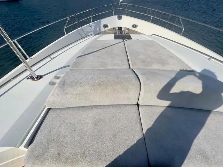  Yacht Photos Pics Sun deck of a 2015 Princess 82 yacht on calm waters.