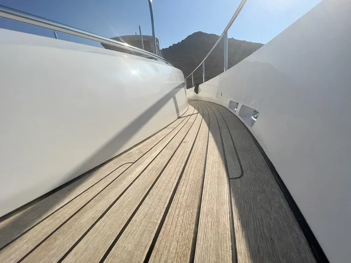  Yacht Photos Pics Deck of a 2015 Princess 82 yacht in sunlight.
