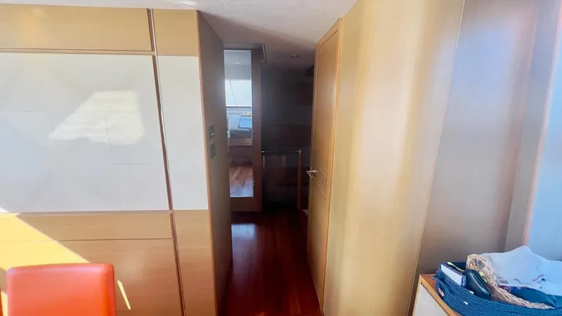  Yacht Photos Pics Interior of a 2015 Princess 82 yacht with wooden floors and modern furnishings.