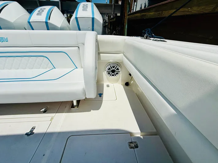  Yacht Photos Pics 2003 Intrepid 377 boat interior with seating and engine view.