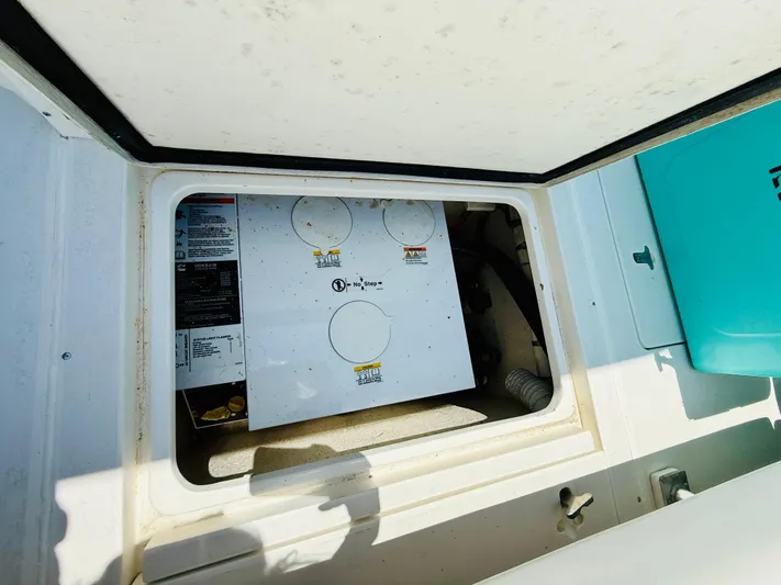  Yacht Photos Pics 2003 Intrepid 377 boat compartment with equipment and storage space.