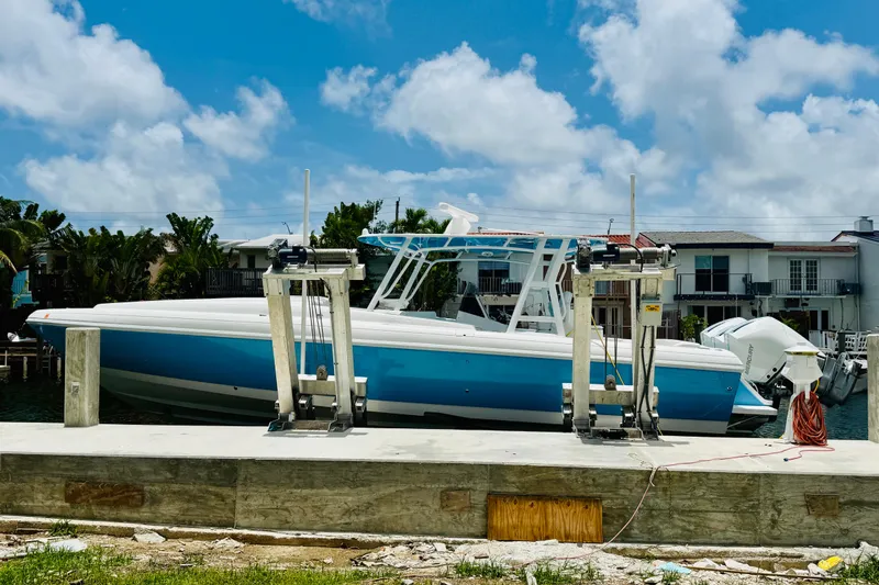  Yacht Photos Pics 2003 Intrepid 377 boat docked under a clear blue sky.