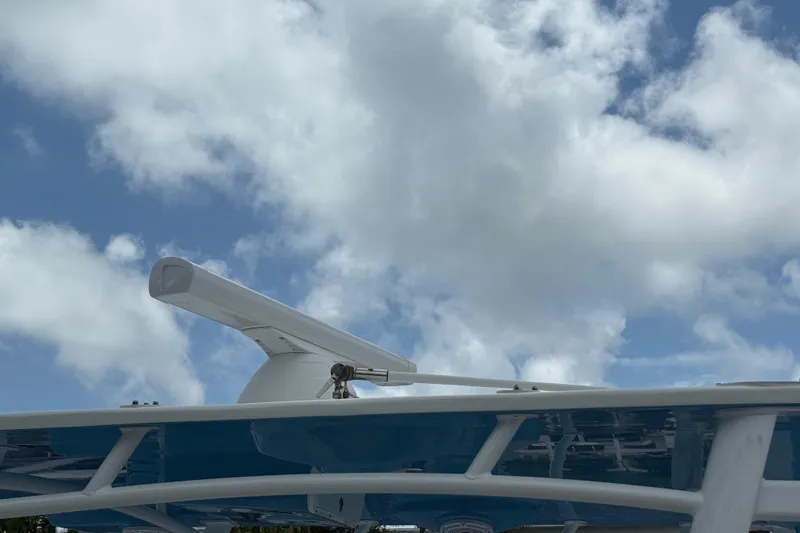  Yacht Photos Pics Radar equipment on a 2003 Intrepid 377 boat against a cloudy sky.