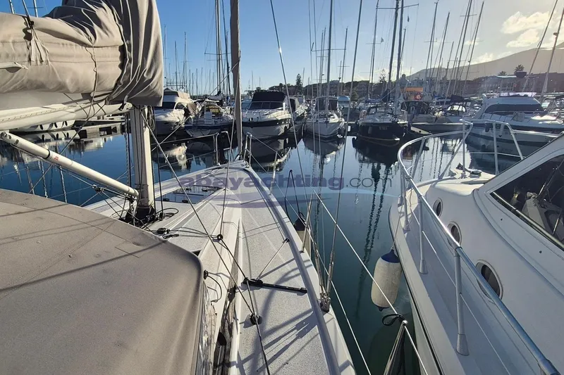  Yacht Photos Pics Italia Yachts Italia 11.98, 2021 model, docked in a marina with other boats.