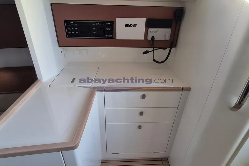  Yacht Photos Pics Italia Yachts 11.98, 2021 model, yacht interior with control panel and storage.
