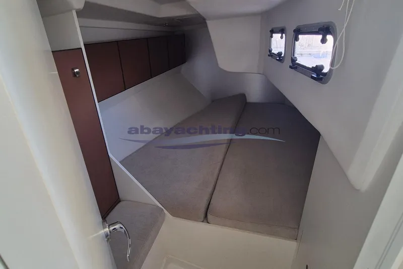  Yacht Photos Pics Interior cabin of 2021 Italia Yachts Italia 11.98 with cozy seating and windows.