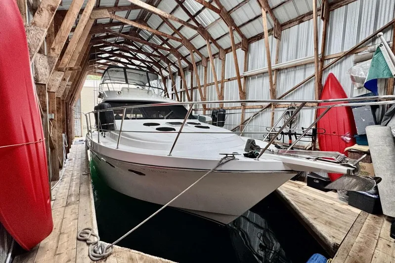  Yacht Photos Pics 1998 Ocean Alexander 420 yacht docked in a wooden boathouse.