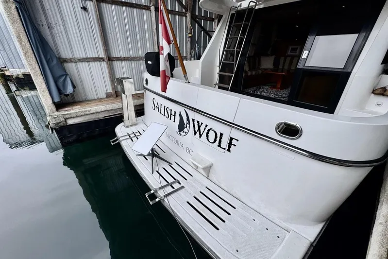  Yacht Photos Pics 1998 Ocean Alexander 420 yacht docked, featuring "Salish Wolf" name and Canadian flag.