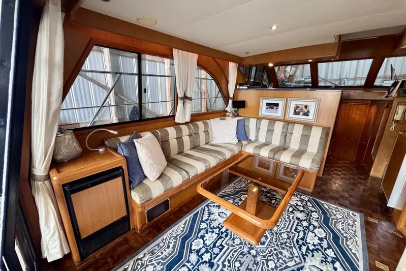  Yacht Photos Pics Luxurious interior of 1998 Ocean Alexander 420 yacht with striped seating and elegant decor.