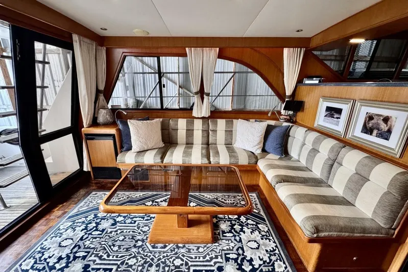  Yacht Photos Pics Luxurious interior of 1998 Ocean Alexander 420 yacht with striped seating and elegant decor.