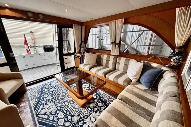  Yacht Photos Pics Luxurious 1998 Ocean Alexander 420 yacht interior with striped seating and elegant decor.