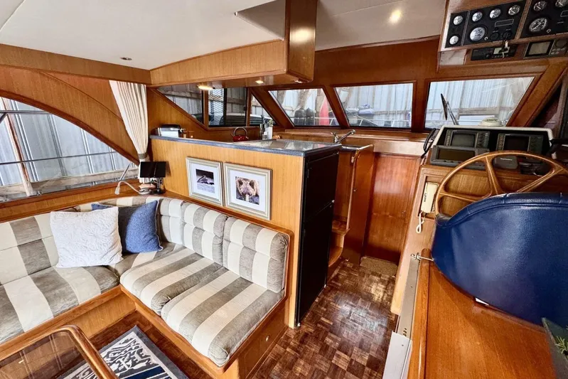  Yacht Photos Pics Interior of 1998 Ocean Alexander 420 yacht with wood finish and striped seating.