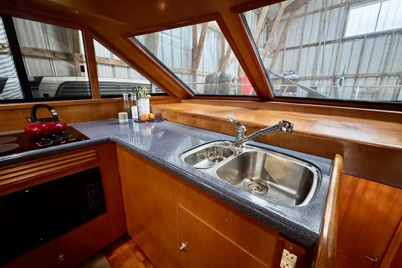  Yacht Photos Pics Luxurious kitchen interior of 1998 Ocean Alexander 420 yacht with modern amenities.