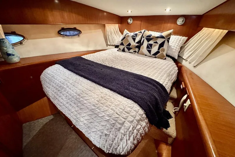  Yacht Photos Pics Luxurious cabin interior of 1998 Ocean Alexander 420 yacht with cozy bedding.