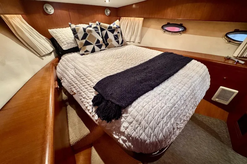  Yacht Photos Pics Luxurious cabin interior of 1998 Ocean Alexander 420 yacht with cozy bedding.