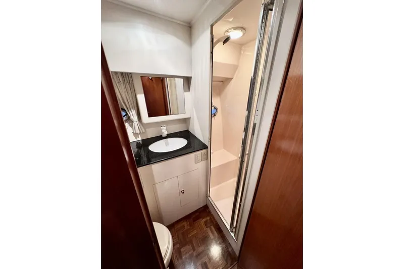  Yacht Photos Pics Bathroom interior of 1998 Ocean Alexander 420 yacht with shower and sink.